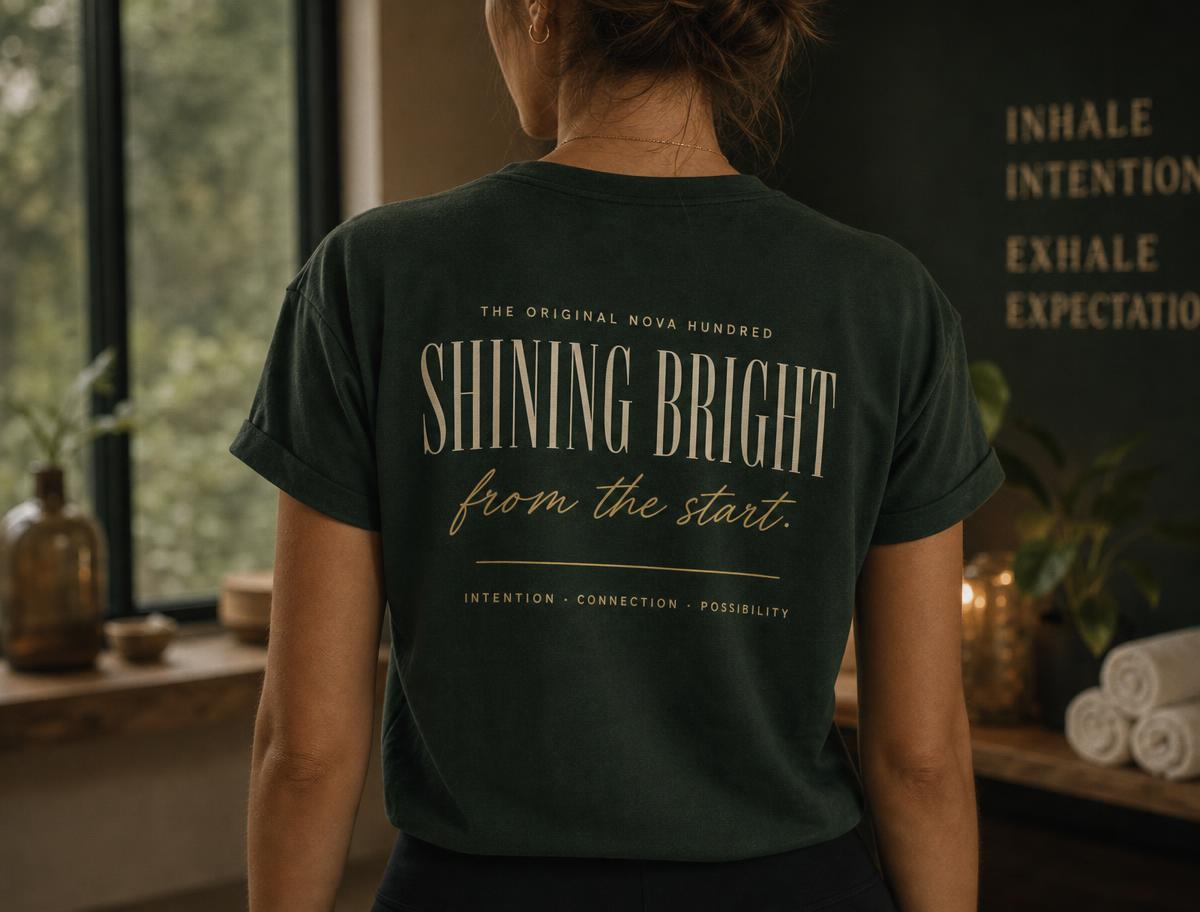 Woman wearing the exclusive Original NOVA Hundred Founding Member T-Shirt